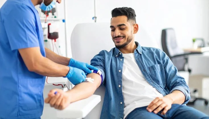 A healthcare professional collecting a sample during a health screening